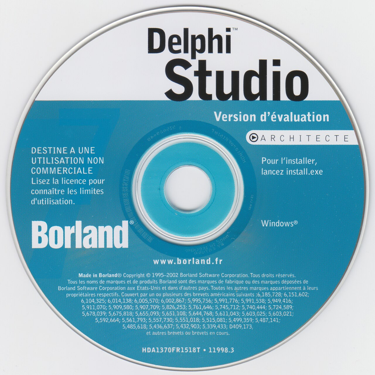 Disco de instalação azul e branco com os dizeres Delphi Studio, versão de avaliação, Architecte e o nome Borland, em francês.